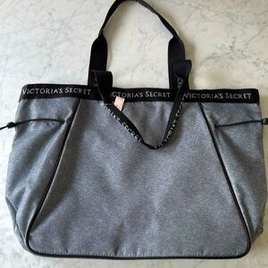 New with tags Victoria’s Secret tote bag. Gray with black handles.